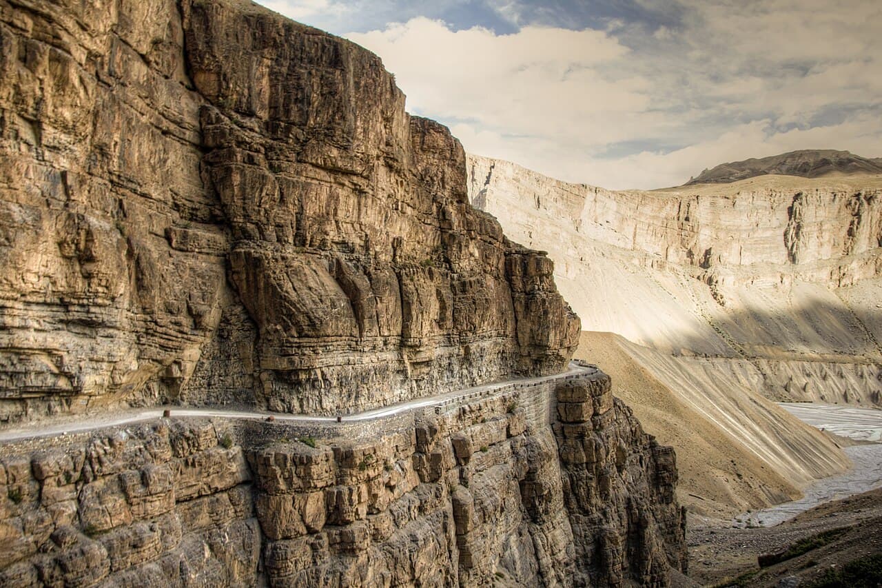 A narrow road cut into a cliff face on the way to Spiti, the kind of stretch where a phone loses signal.